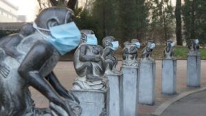 Face masks were placed on stone monkeys at the Beijing Zoo on Dec. 19 to protest heavy air pollution in northeast China. A week earlier, riot police cracked down after artists put similar masks on human figures in Chengdu.